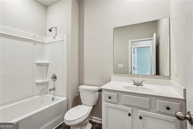 full bathroom featuring toilet, bathing tub / shower combination, and vanity