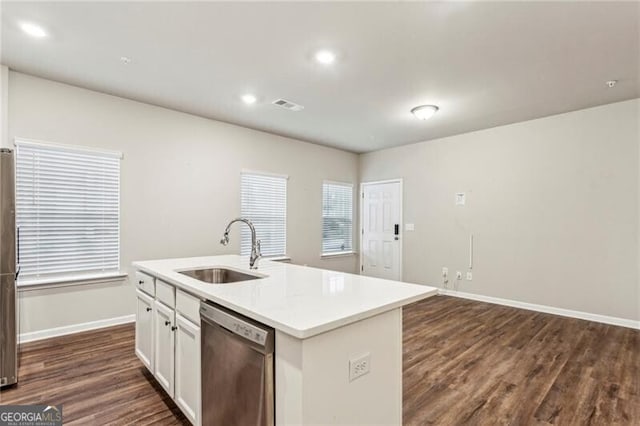 kitchen with white cabinetry, dark hardwood / wood-style floors, a kitchen island with sink, dishwasher, and sink