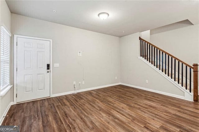 empty room with dark hardwood / wood-style floors