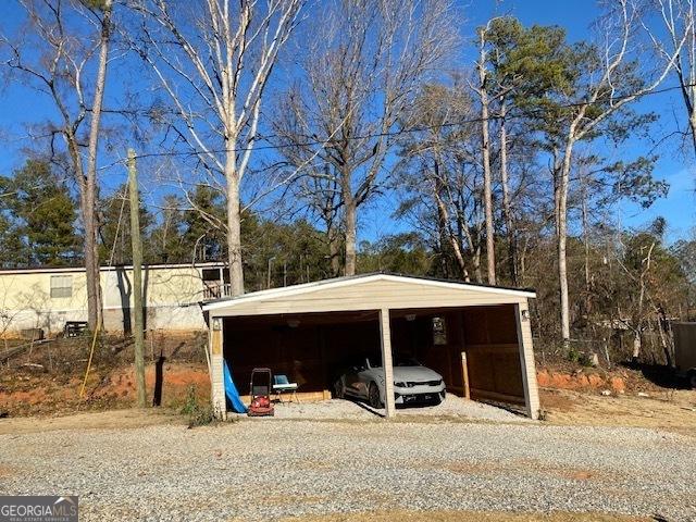 view of parking with a carport