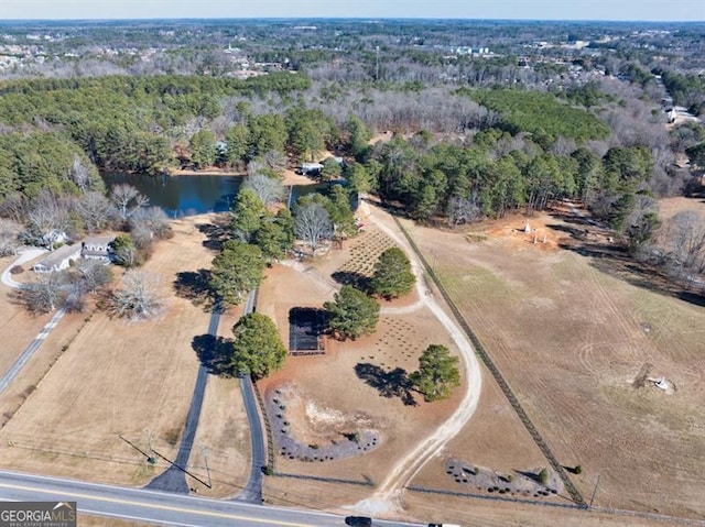 aerial view with a water view and a rural view