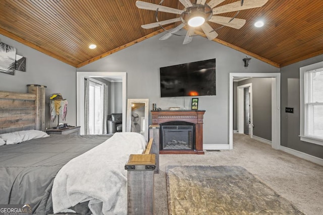 bedroom featuring lofted ceiling, wood ceiling, and carpet