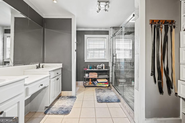 bathroom featuring vanity, tile patterned floors, and walk in shower