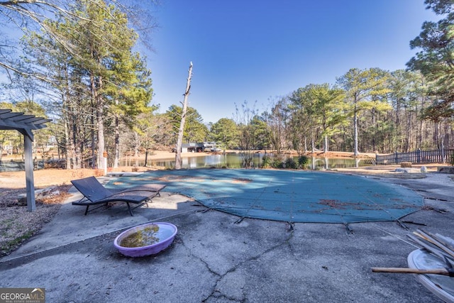 view of pool featuring a water view, a pergola, and a patio area