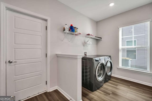 washroom featuring washer and clothes dryer and hardwood / wood-style floors