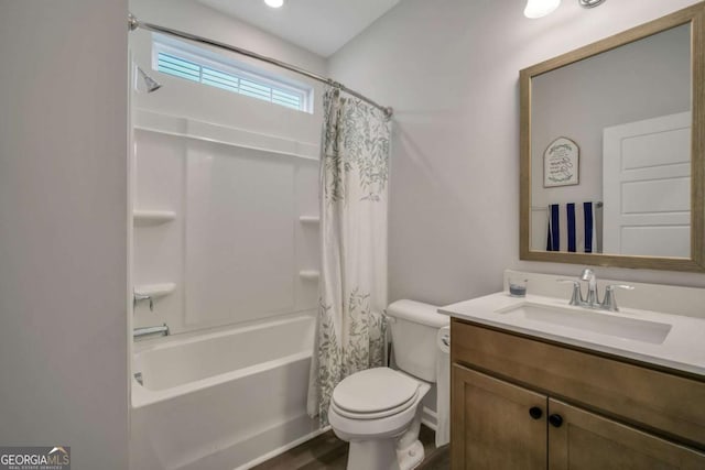 full bathroom with toilet, vanity, and shower / bath combo with shower curtain