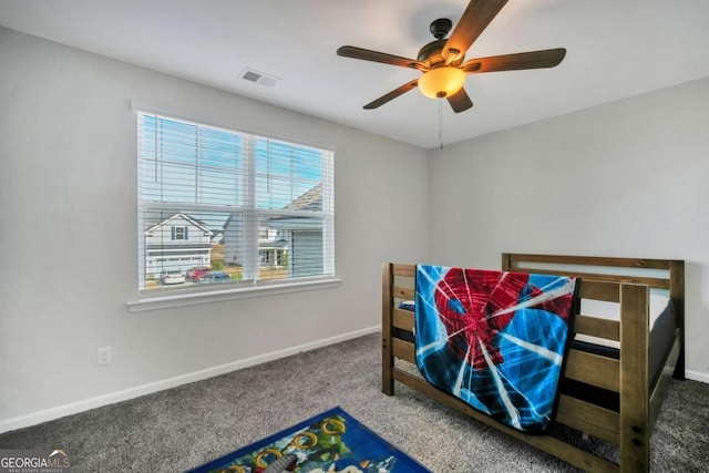 bedroom with ceiling fan and carpet