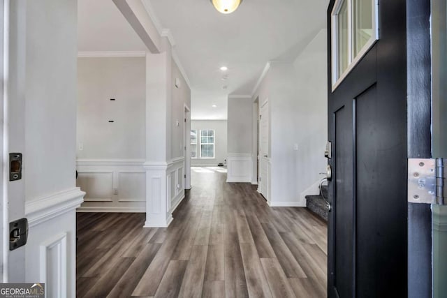 corridor featuring hardwood / wood-style flooring and crown molding