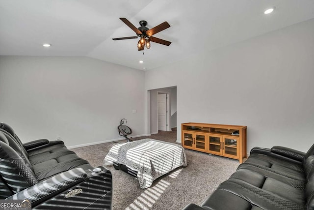 carpeted living room with ceiling fan and lofted ceiling