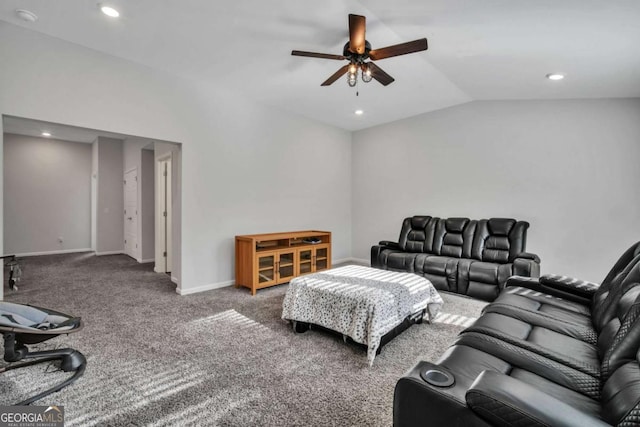 carpeted living room with ceiling fan and lofted ceiling