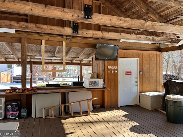 interior space with wooden ceiling, wood-type flooring, wood walls, and vaulted ceiling