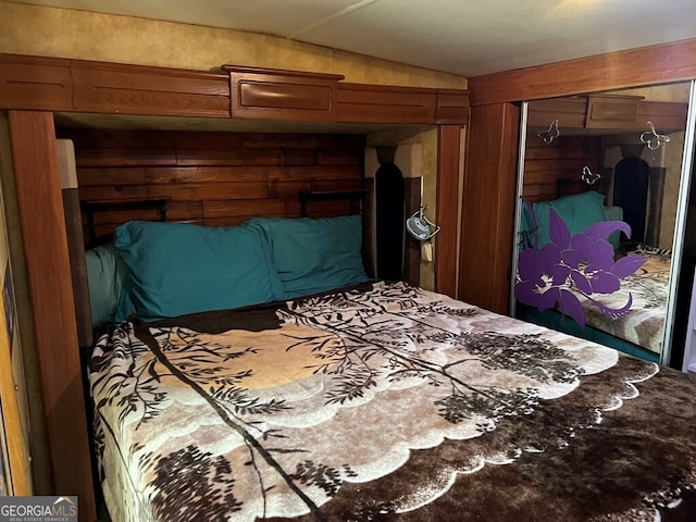 bedroom featuring a closet and lofted ceiling