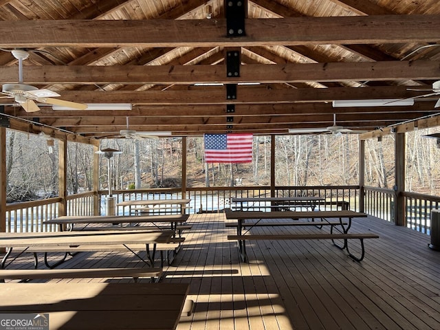 wooden terrace featuring ceiling fan