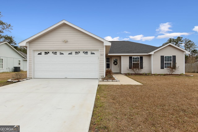 ranch-style home featuring central AC unit, a front yard, and a garage