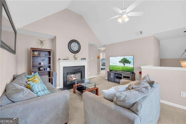 living room with light carpet, vaulted ceiling, and ceiling fan