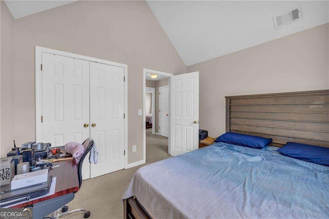 bedroom with a closet, dark colored carpet, and high vaulted ceiling