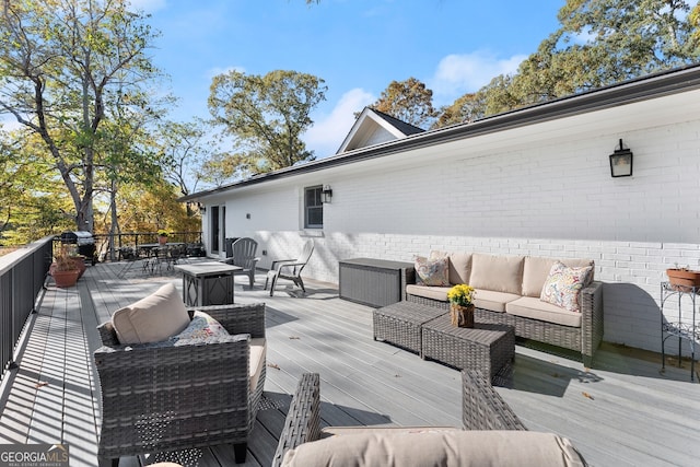 deck featuring outdoor lounge area