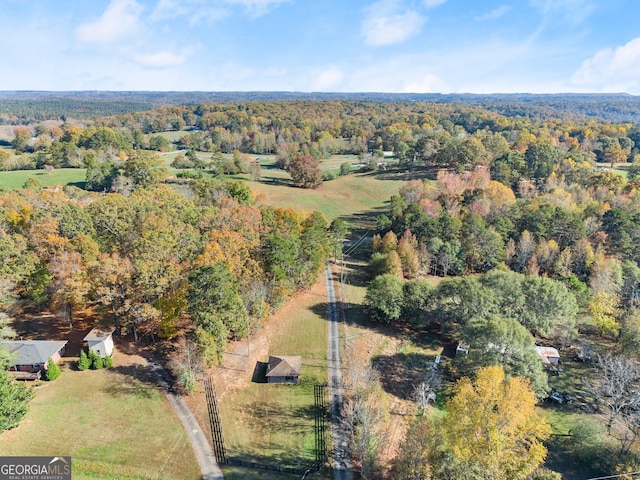 birds eye view of property with a rural view