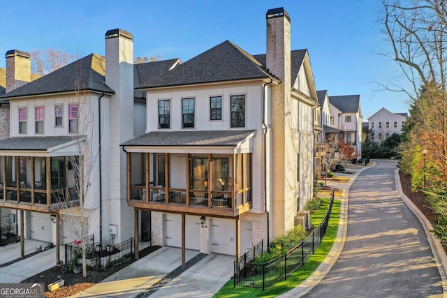 back of property featuring a garage