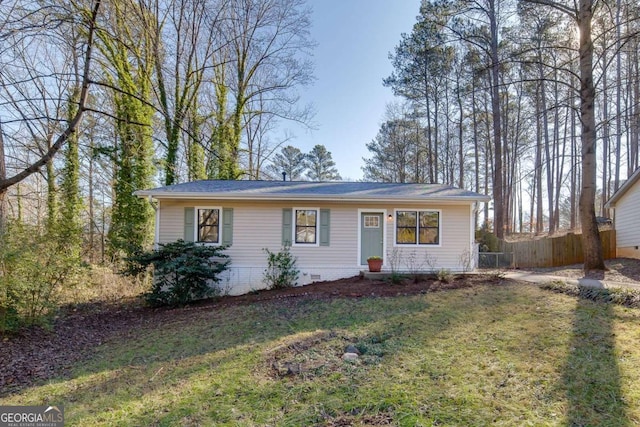 ranch-style home featuring a front yard