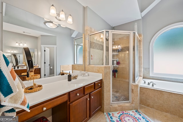 189 Bear Cub Way, Bogart, GA 30622 - bathroom featuring vanity, a stall shower, a garden tub, tile patterned floors, and lofted ceiling