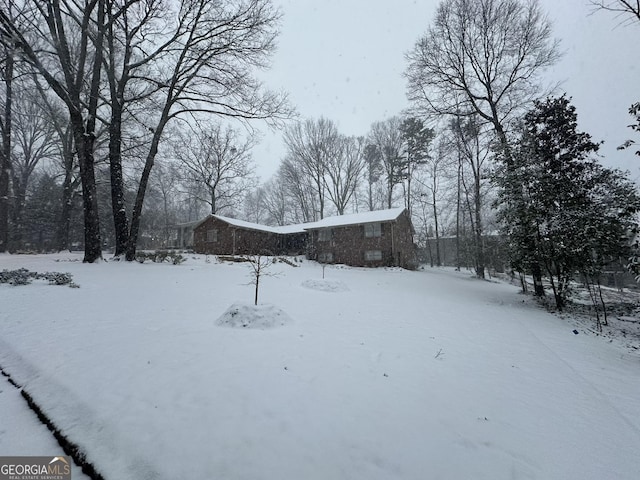 view of yard layered in snow