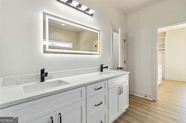 bathroom with vanity and hardwood / wood-style floors