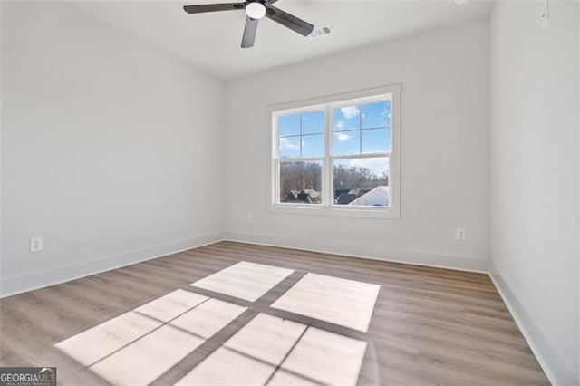 unfurnished room featuring ceiling fan and light hardwood / wood-style flooring