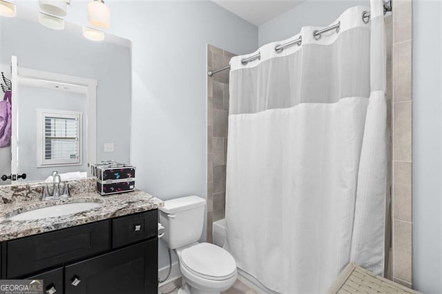 bathroom with shower / tub combo, vanity, and toilet