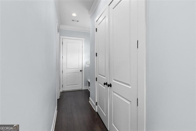 corridor featuring dark wood-style floors, baseboards, crown molding, and recessed lighting