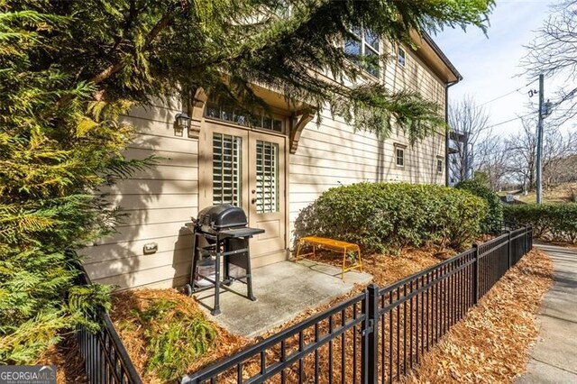 view of home's exterior featuring a patio and french doors