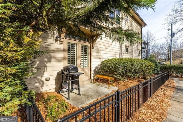 view of patio with fence and area for grilling