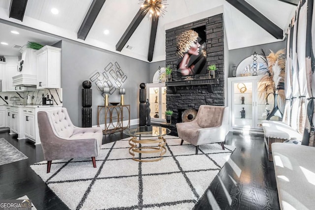 living room with high vaulted ceiling, dark hardwood / wood-style flooring, beamed ceiling, and a stone fireplace