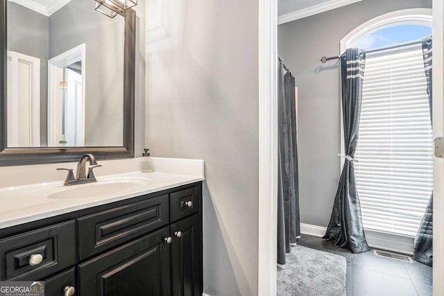 bathroom with tile patterned floors, vanity, and ornamental molding