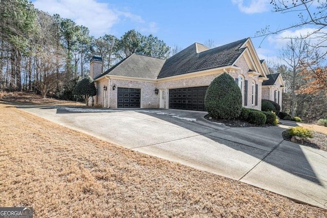 view of side of home with a garage