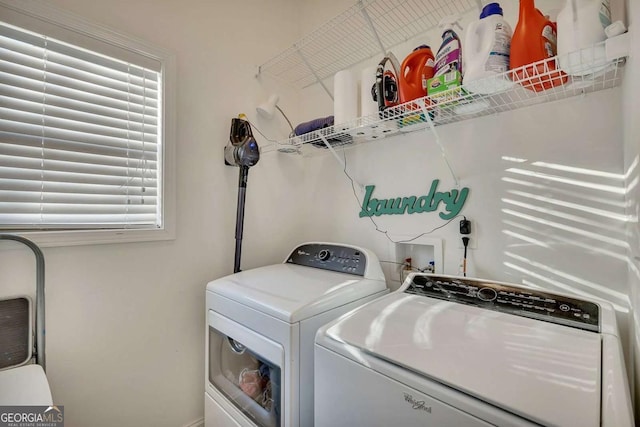 laundry area featuring washing machine and dryer and plenty of natural light