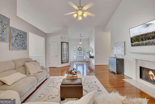 living room with ceiling fan and hardwood / wood-style flooring