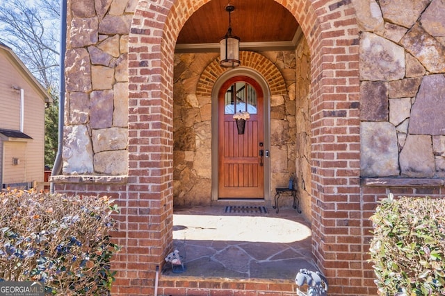 entrance to property with brick siding