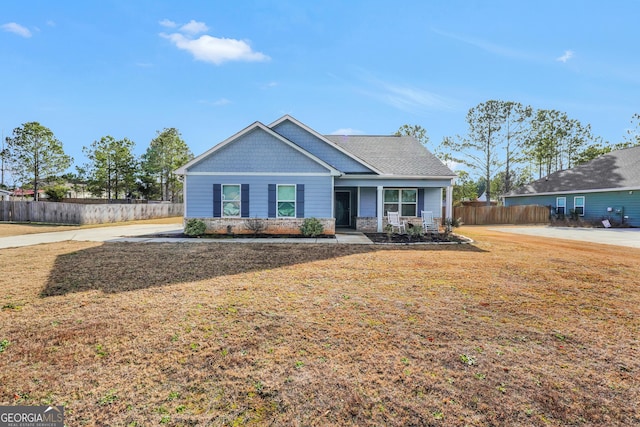 view of front of home with a front lawn and a porch