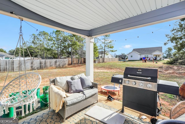 view of patio / terrace featuring an outdoor hangout area, a trampoline, and grilling area