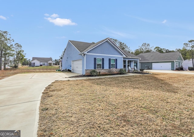 ranch-style home with a garage and a front lawn