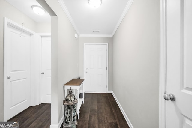 corridor featuring dark hardwood / wood-style flooring and ornamental molding