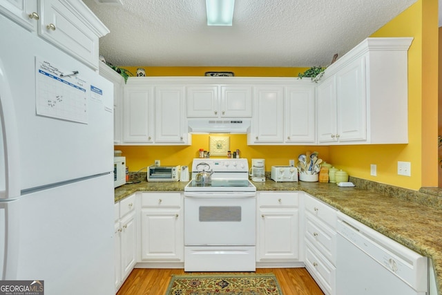 kitchen featuring white cabinets, light wood-type flooring, white appliances, and a textured ceiling