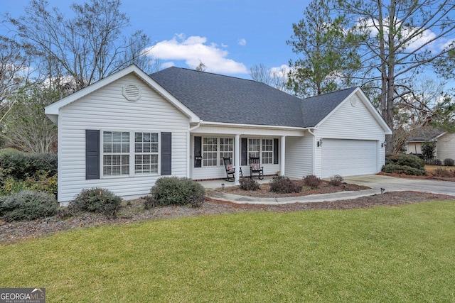 view of front of house featuring a garage, a front lawn, and a porch