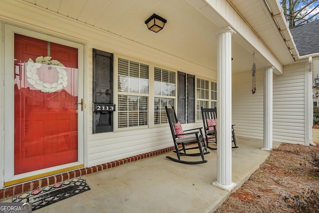 doorway to property featuring covered porch