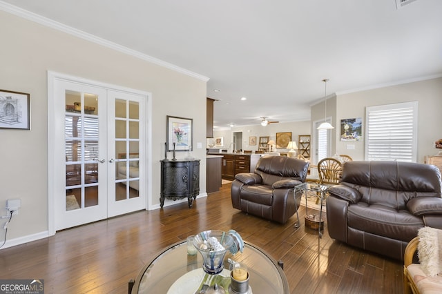 living room with baseboards, ornamental molding, dark wood finished floors, and french doors