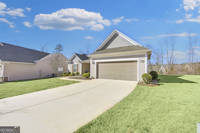 view of front of property featuring a garage, a front lawn, concrete driveway, and roof with shingles