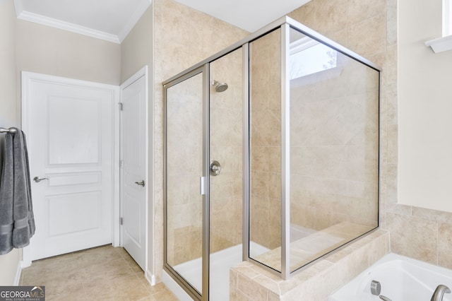 bathroom featuring a stall shower, a tub, crown molding, and tile patterned floors