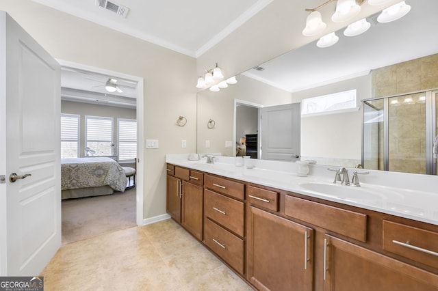 ensuite bathroom featuring ensuite bathroom, a sink, visible vents, ornamental molding, and a shower stall