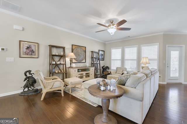 living area with dark wood-style flooring, visible vents, and a healthy amount of sunlight